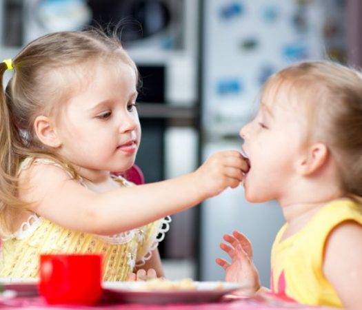 Two children sharing food while on low FODMAP diet