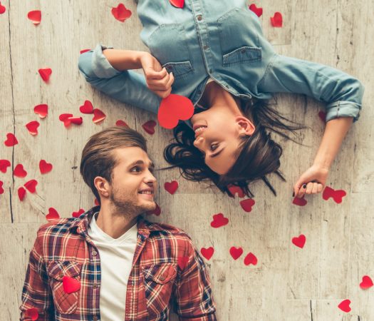 Young couple on low FODMAP date surrounded by hearts