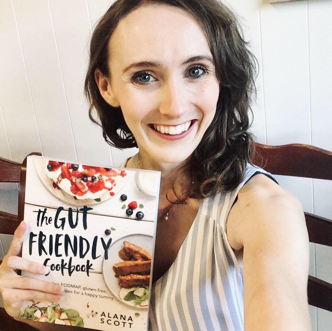 Alana Scott holding The Gut Friendly Cookbook